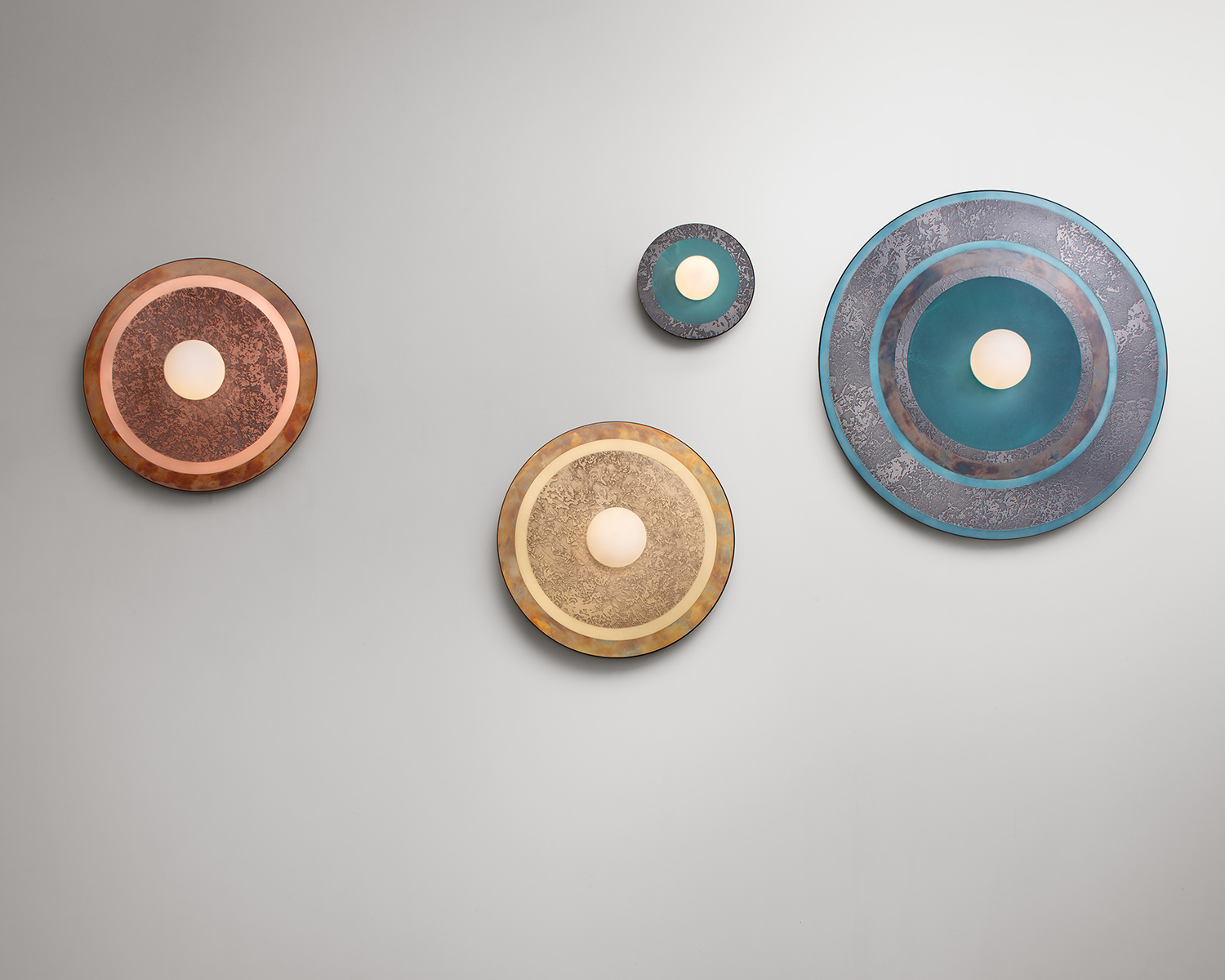 4 Caleide wall lamps from De Castelli against a white wall