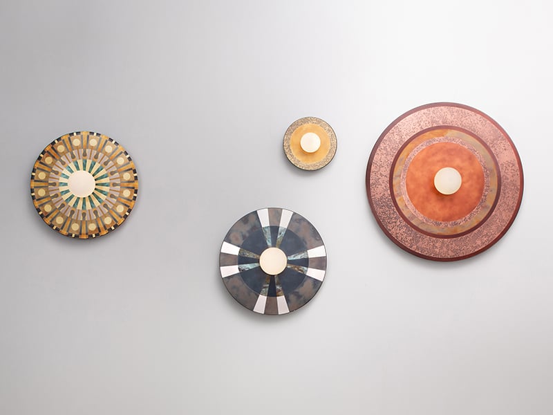 4 Caleide wall lamps from De Castelli against a white wall