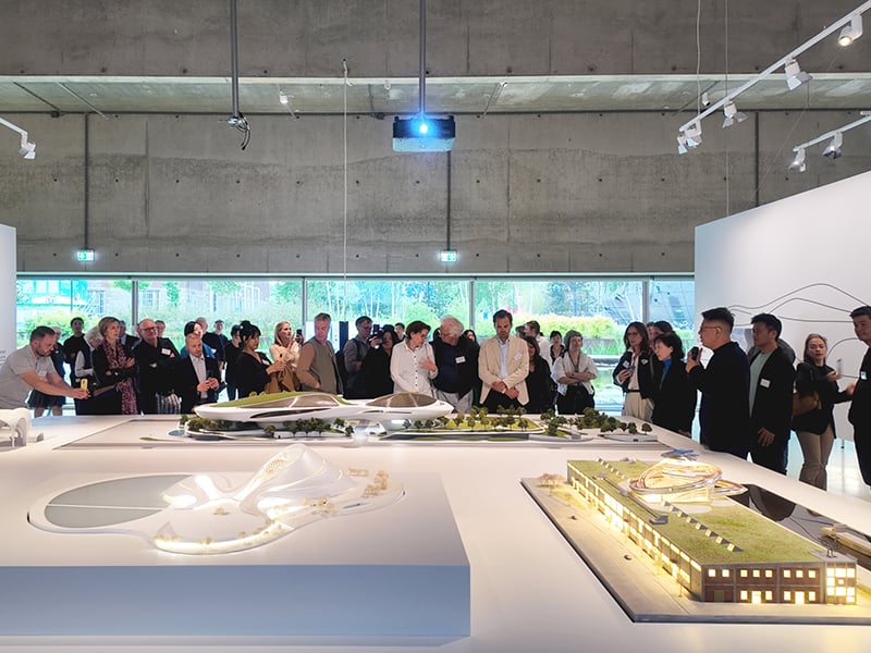 Architecture and Emotion exhibition by Ma Yansong - crowd of people gathered around architectural model