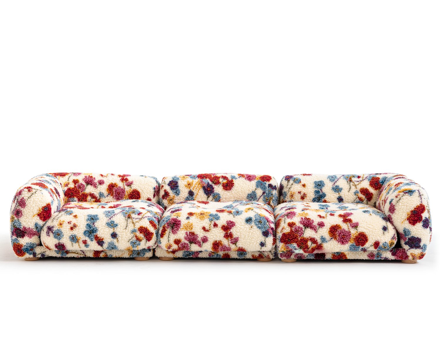 Me-Time couch by Moroso with a red, blue and yellow floral pattern