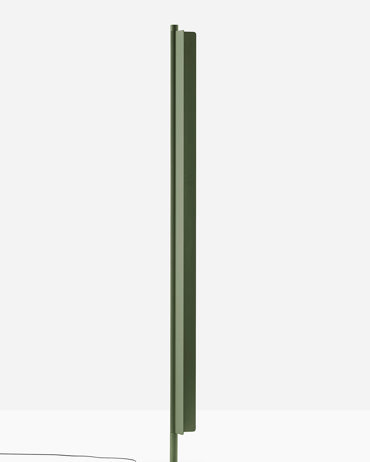 Green Kawara lamp by Pedali in a white room