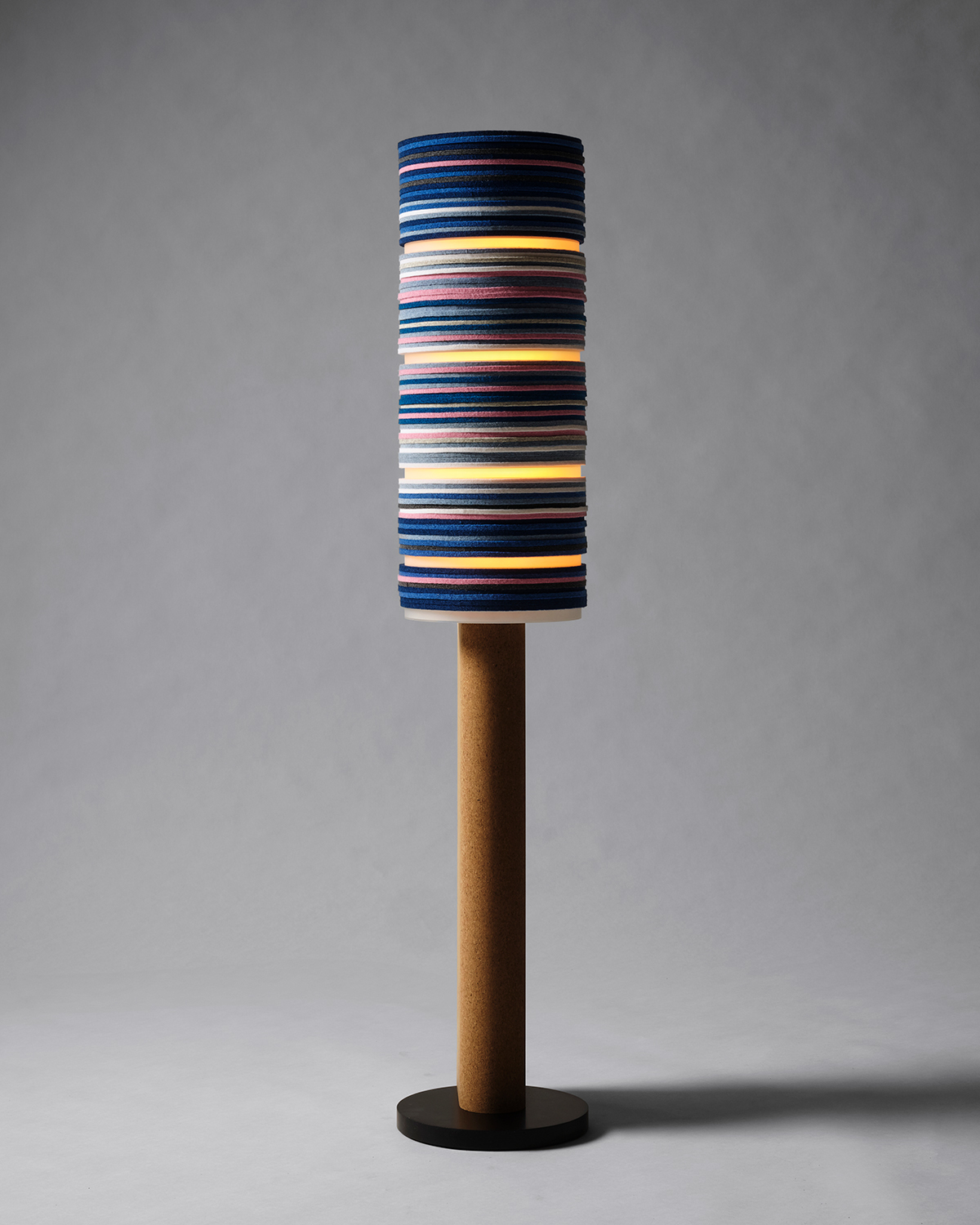 Shift floor lamp by Stackabl and Rockwell Group against a gray background