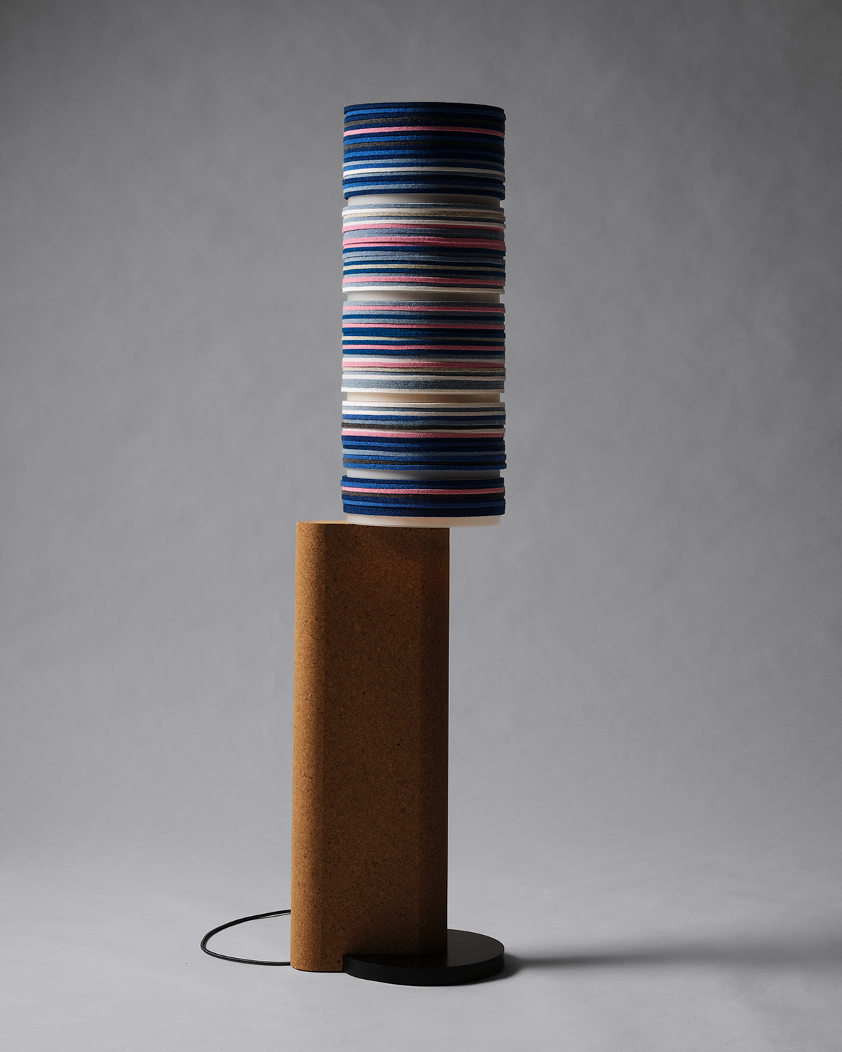 Shift floor lamp by Stackabl and Rockwell Group against a gray background