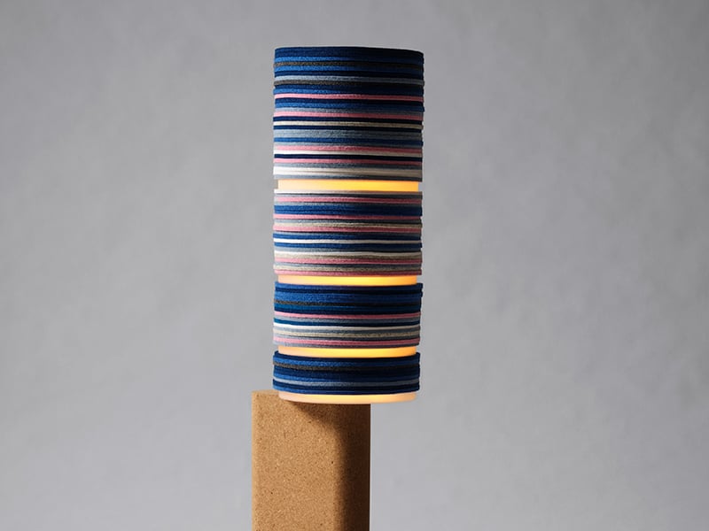 Shift floor lamp by Stackabl and Rockwell Group against a gray background