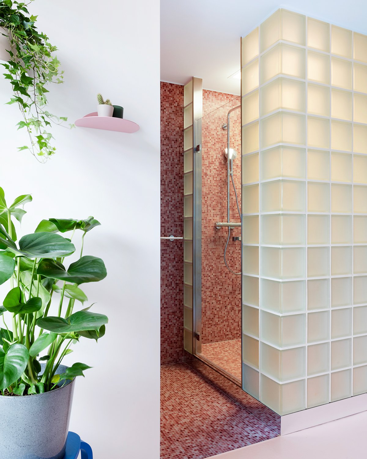 Red tiled shower with plants on the left by TOIETMOI, Atelier Belge and Fermetti
