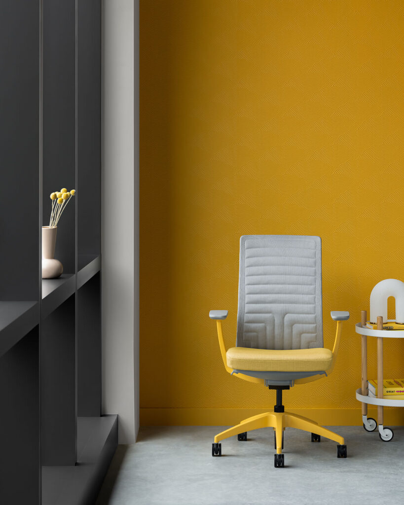 Conference chair with yellow seat and grey quilted back