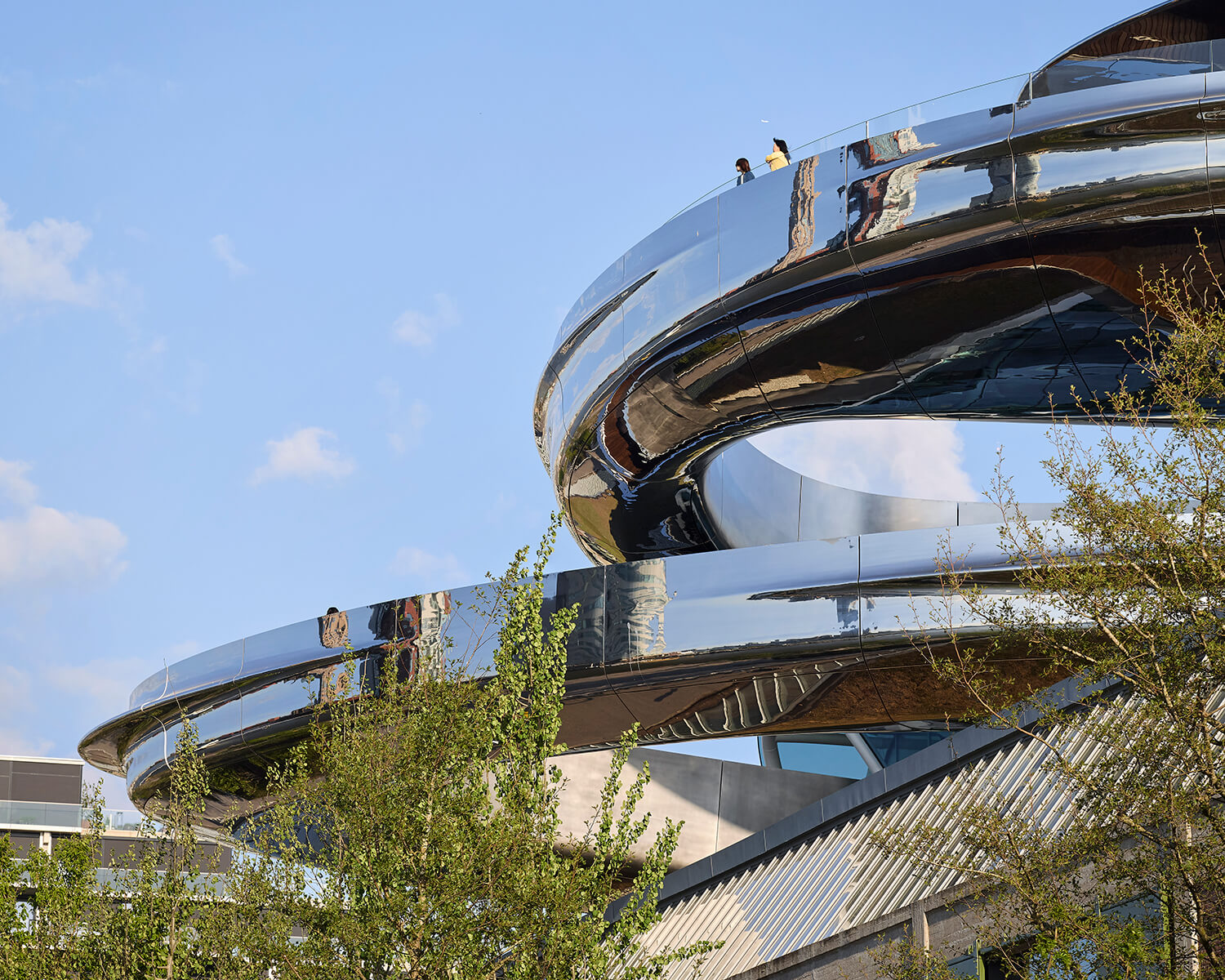 Silver spiral staircase with viewing platform at the top