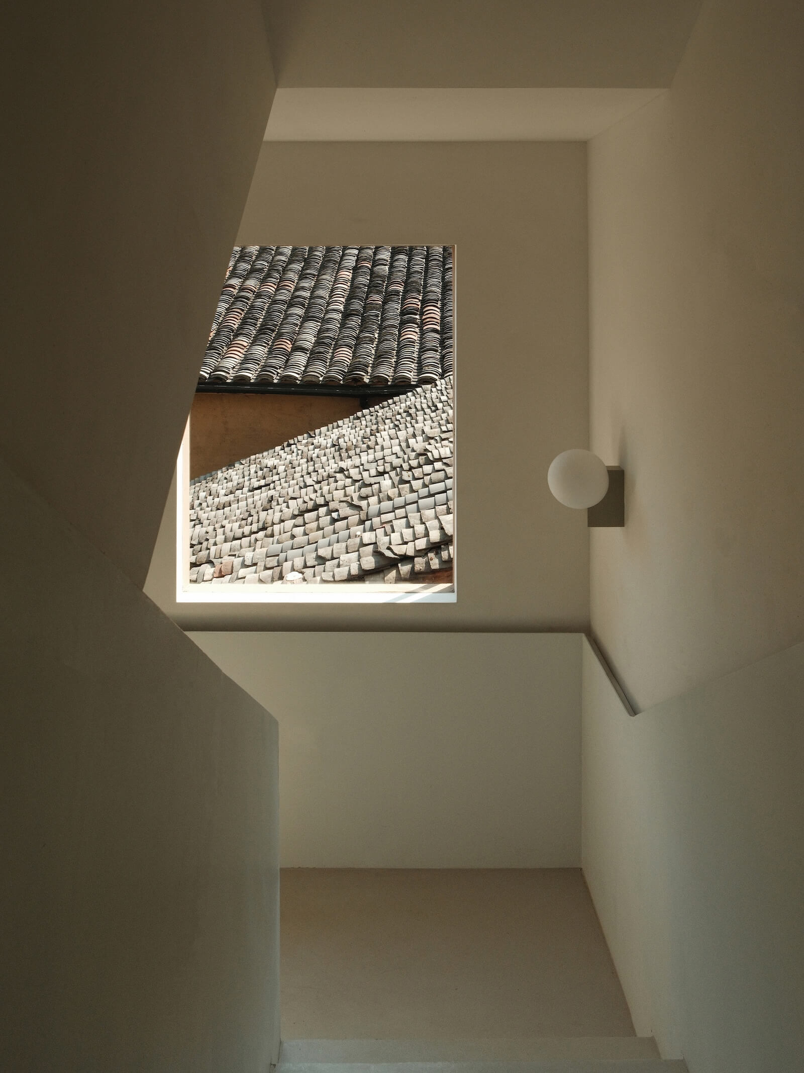 Windows were strategically carved into the three-storey volume of Z Museum to frame curated views of the village.