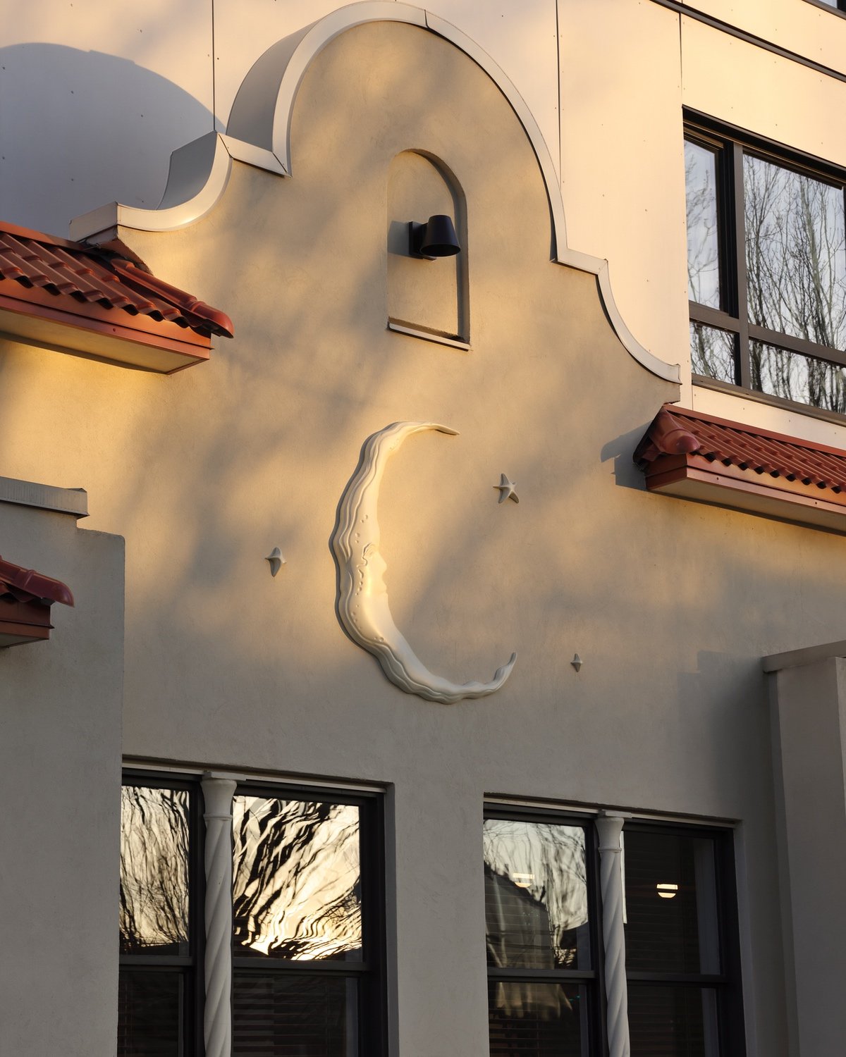 The villa-style exterior of Selene Greek restaurant in Vancouver by design studio &Daughters.