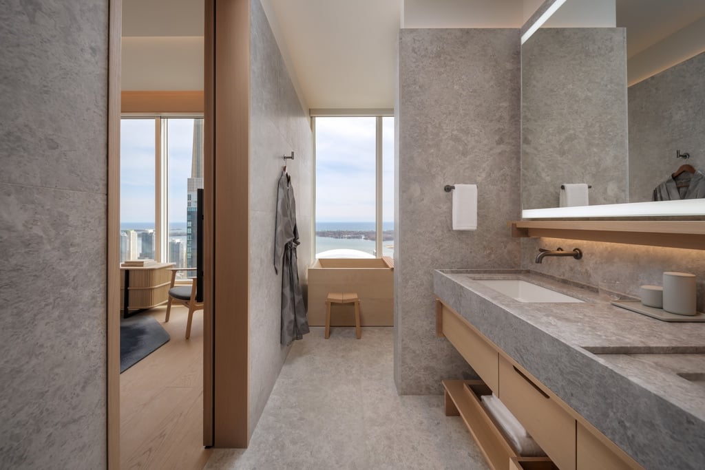 A bathroom clad in grey marble at Nobu Hotel Toronto.