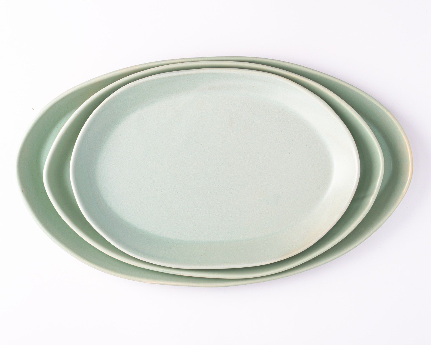 Oval serving platters in celadon by Haand