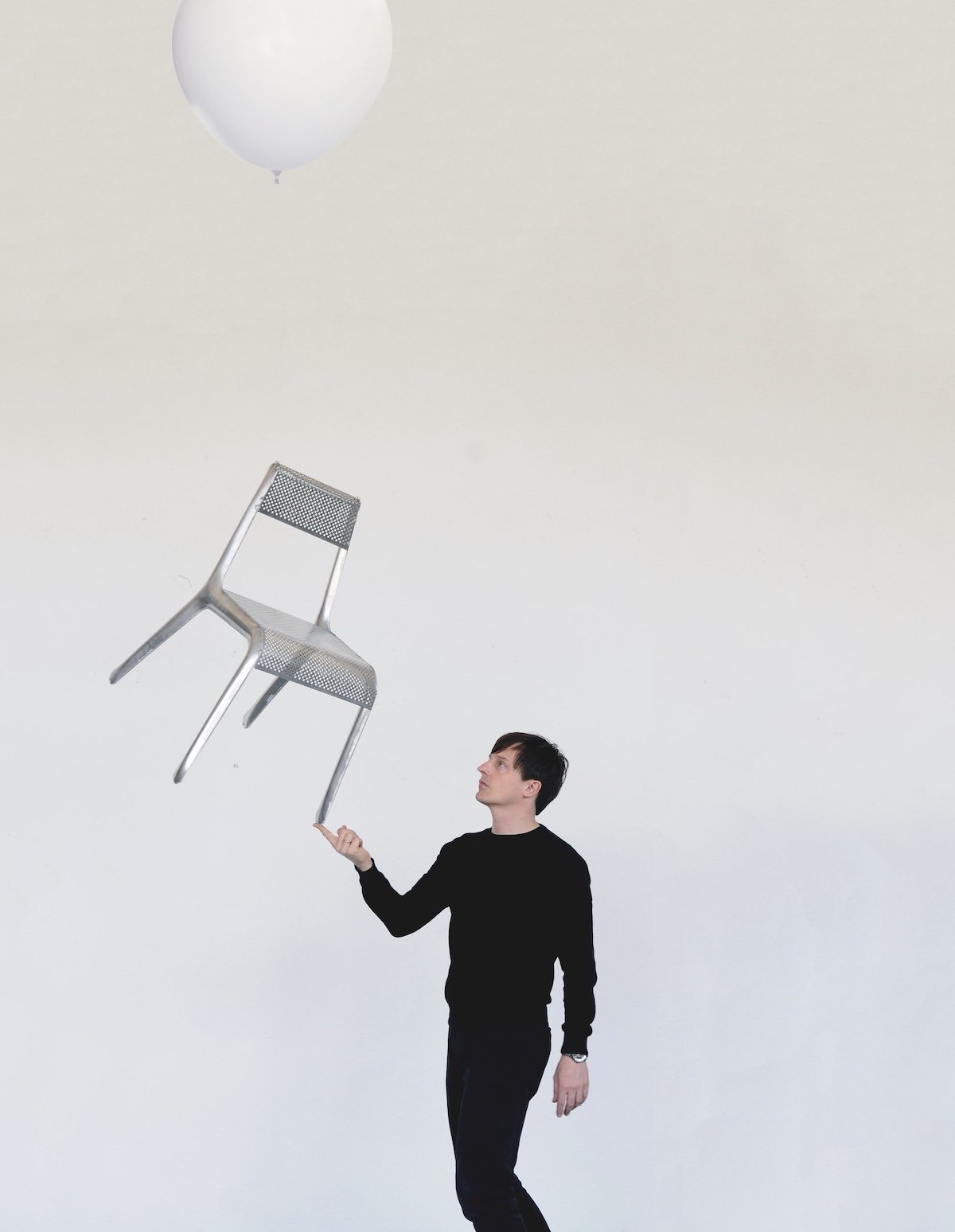 Oskar Zięta shows off the Ultraleggera chair.