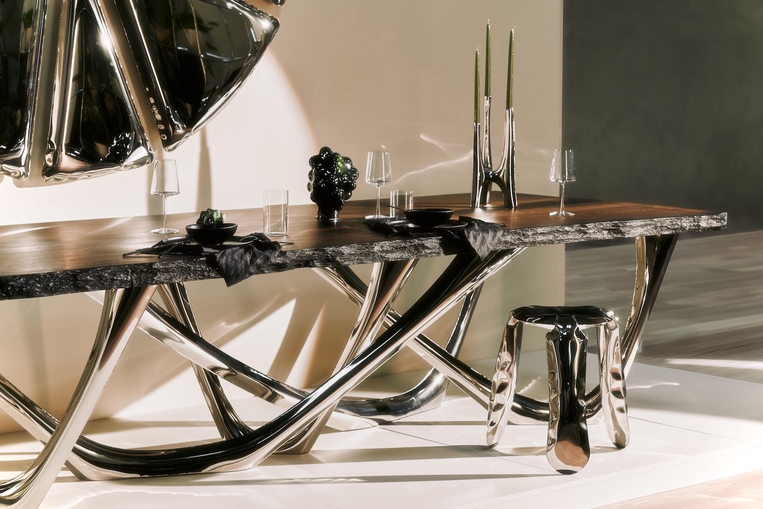 The iconic Plopp stool pictured alongside the G-Table a sliver of the Nucleus mirror.