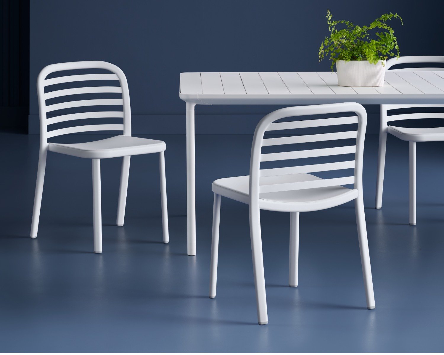 White dining set on a blue background