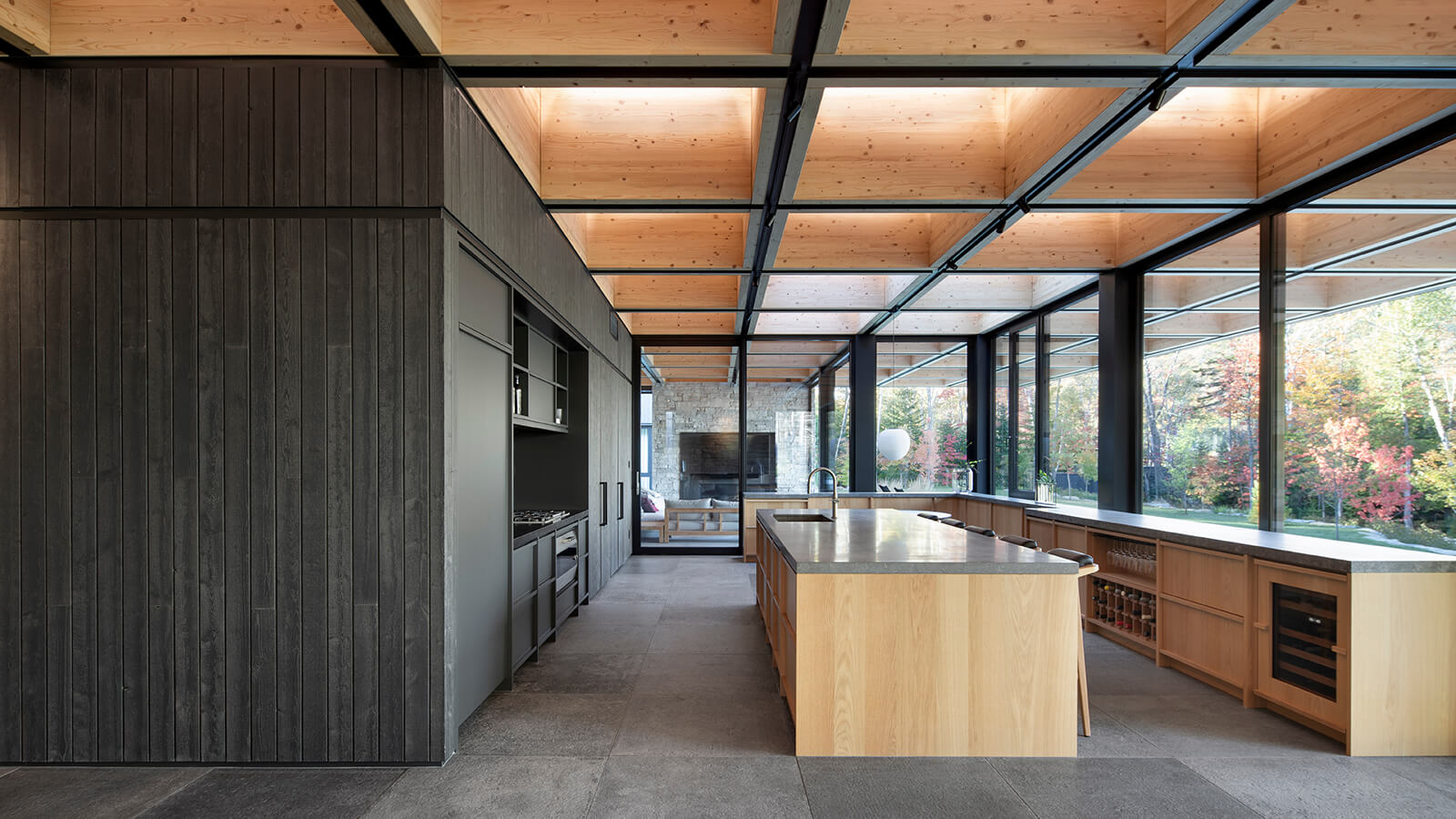 In this ACDF-designed chalet, the coffered roof features integrated linear LEDs that illuminate and accentuate the wood’s grain and acoustic panels that contribute to the home’s overall sense of intimacy and calm.