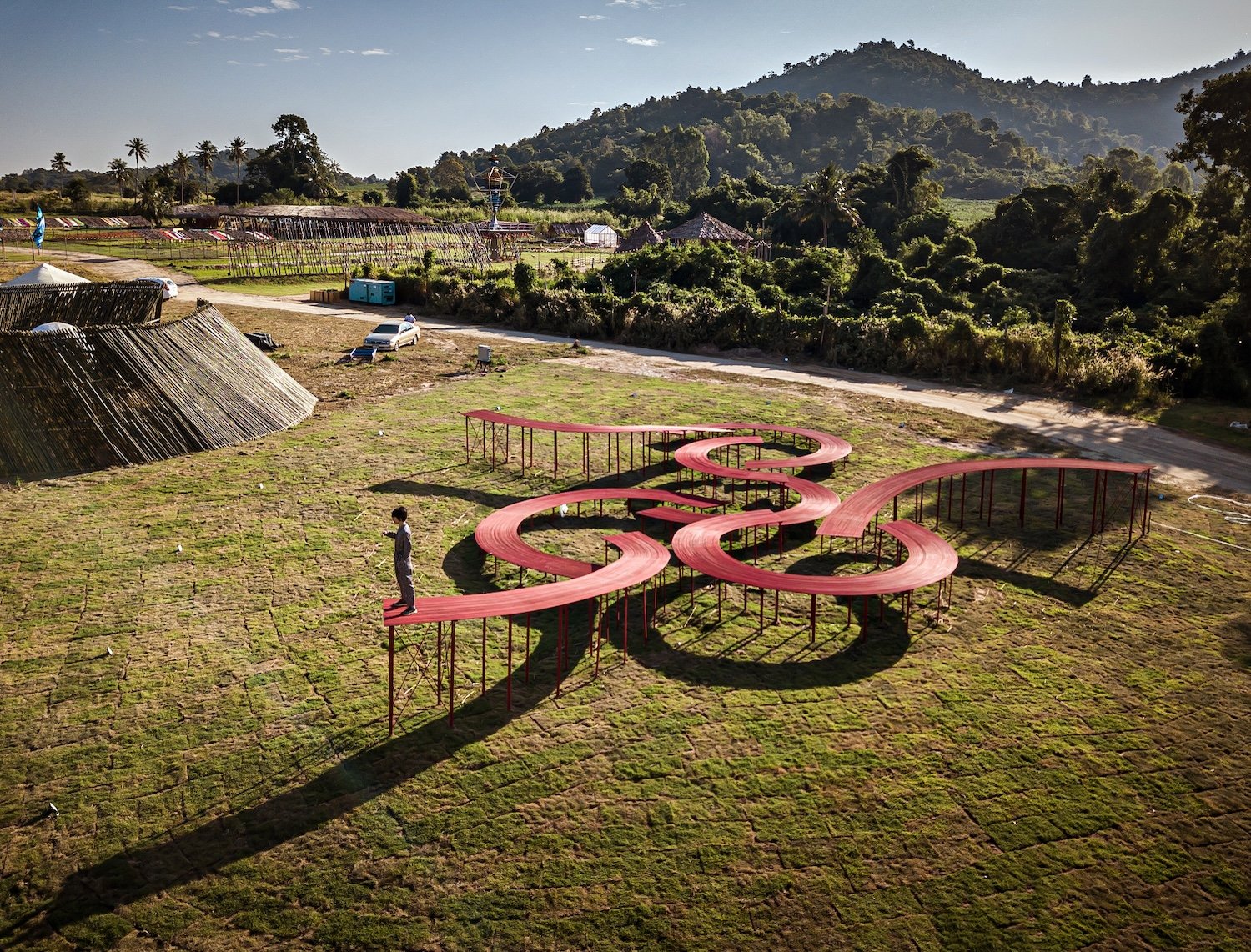 One of Premthada's more whimsical installations, The Walk is an elevated passage of unconnected swirls in The Fields at Siam Country Club, Pattaya, Thailand. It was "conceived with the purpose of helping humans to realize the importance of a small plant like grass and to pay attention to trivial details around them," says the architect.
