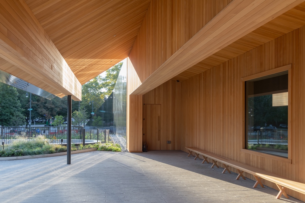 The entrance to Calder Gardens in Philadelphia, featuring a barn-like wood-clad overhang.