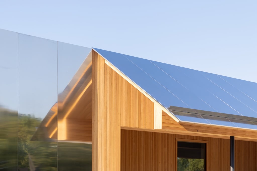 A detail of a mirrored metallic roof canopy.