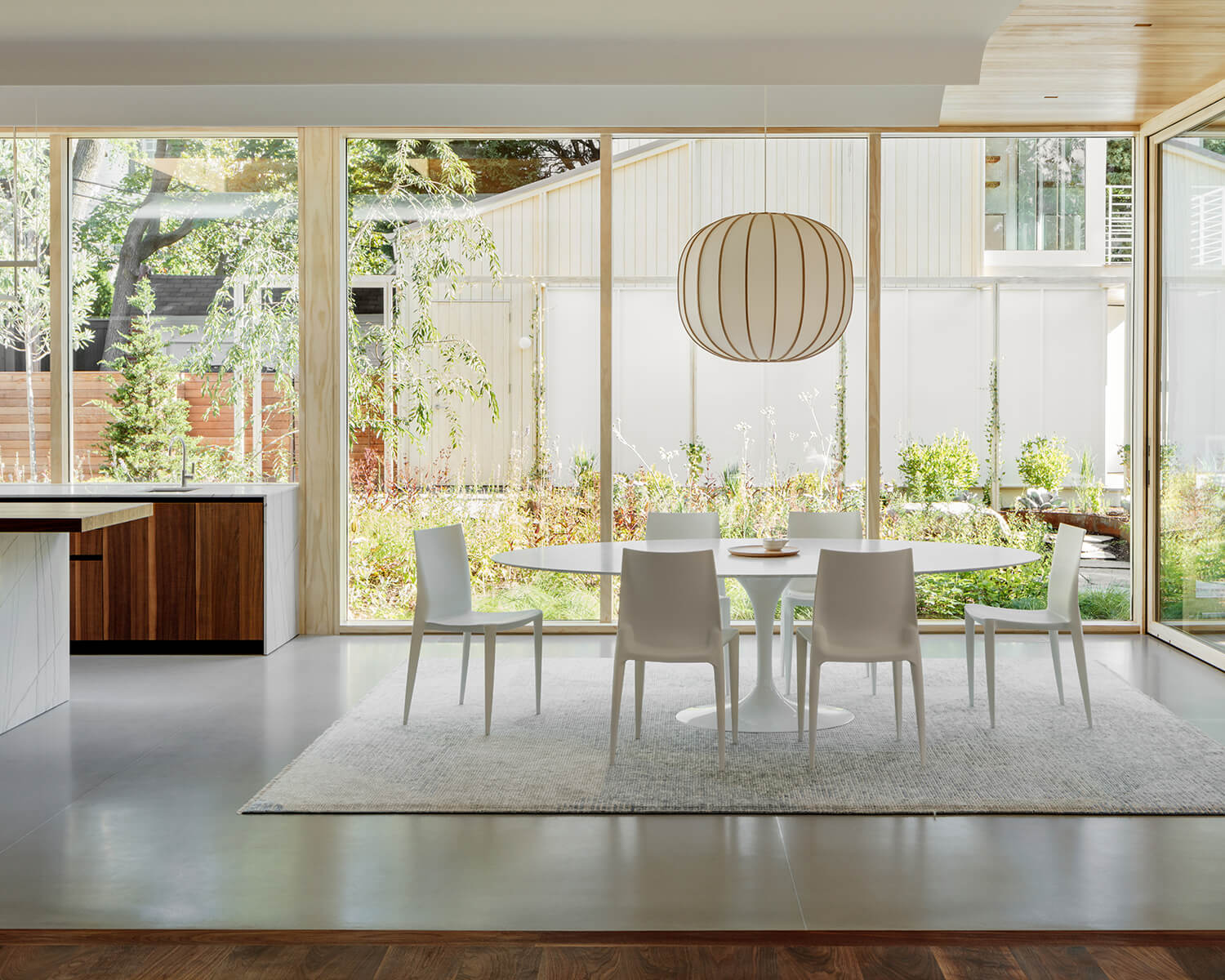 Accessed by a full wall of sliders in the dining room is a “meadow” garden where the homeowners grow a lot of their own herbs and vegetables.