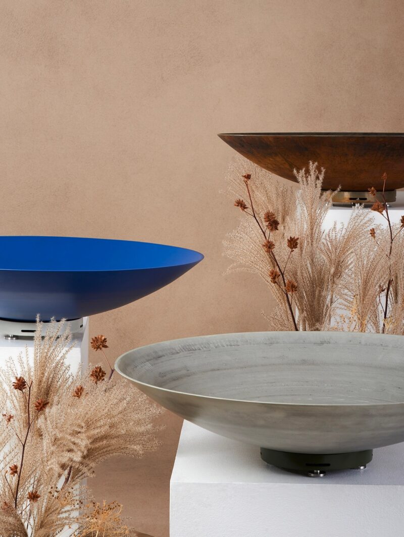 A trio of shallow Été planters by landscape architect Kate Fox-Whyte in a series of different finishes: Corten steel, blue powder-coated aluminum and satin aluminum.