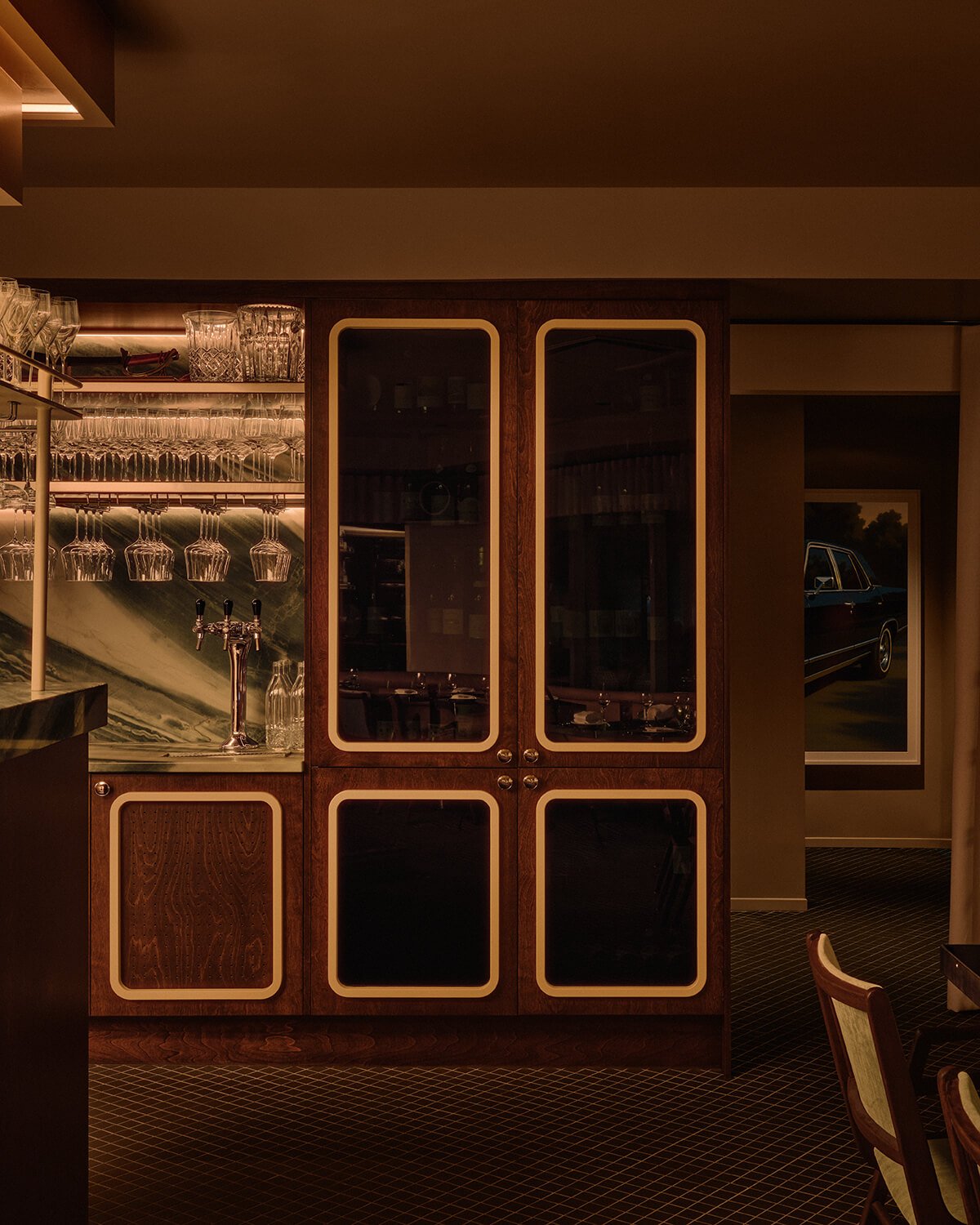 Wooden millwork with smoked glass inserts and rounded cream trim
