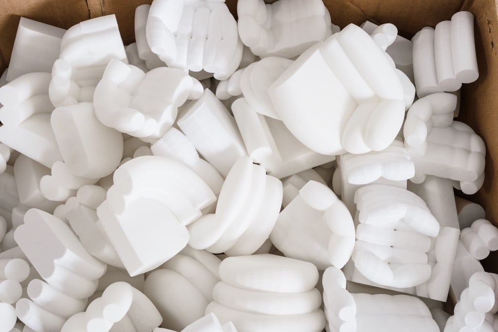 Miniature white sofa models in a box