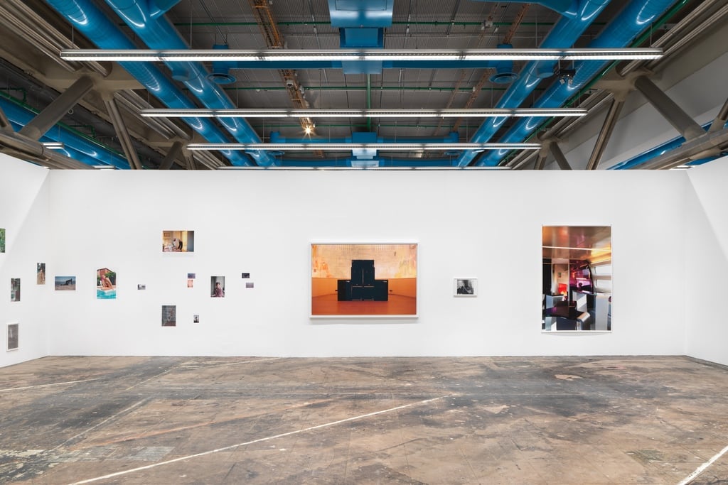 A view of a Wolfgang Tillmanns exhibition held at the Centre Pompidou during Paris Design Week 2025, with photographs of varying sizes=