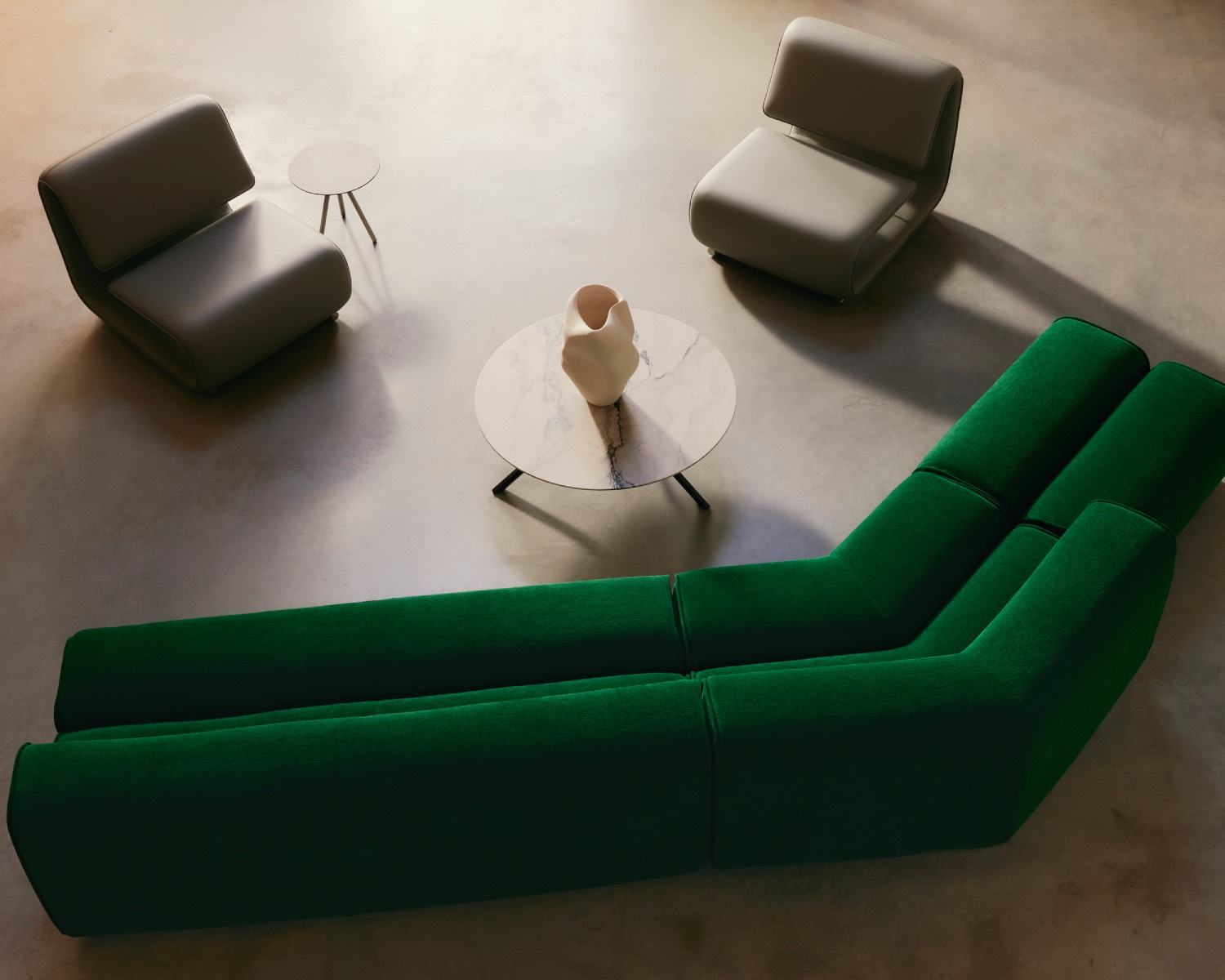 Green sofa and two lounge chairs seen from above
