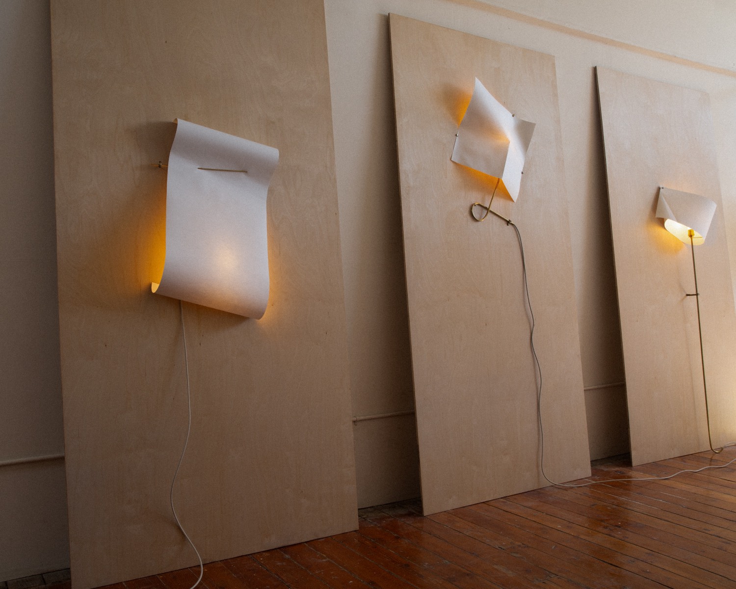 The Paper lights by White Dirt transform sheets of canvas paper into sculpture wall installations