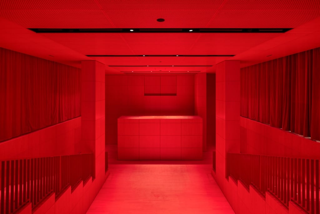 An all-red theatre room inside the Fondation Cartier designed by Jean Nouvel.