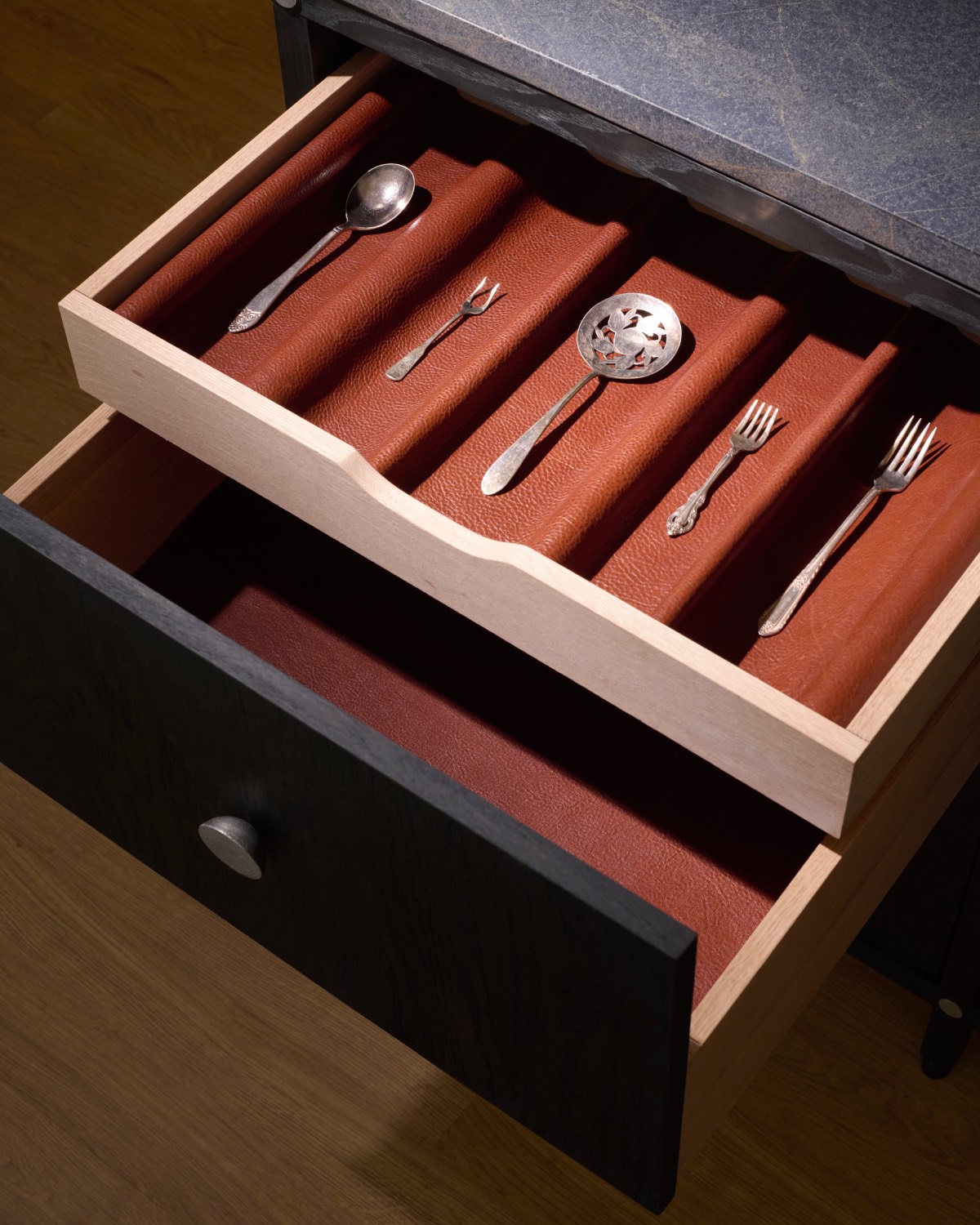Cutlery drawer with red lining