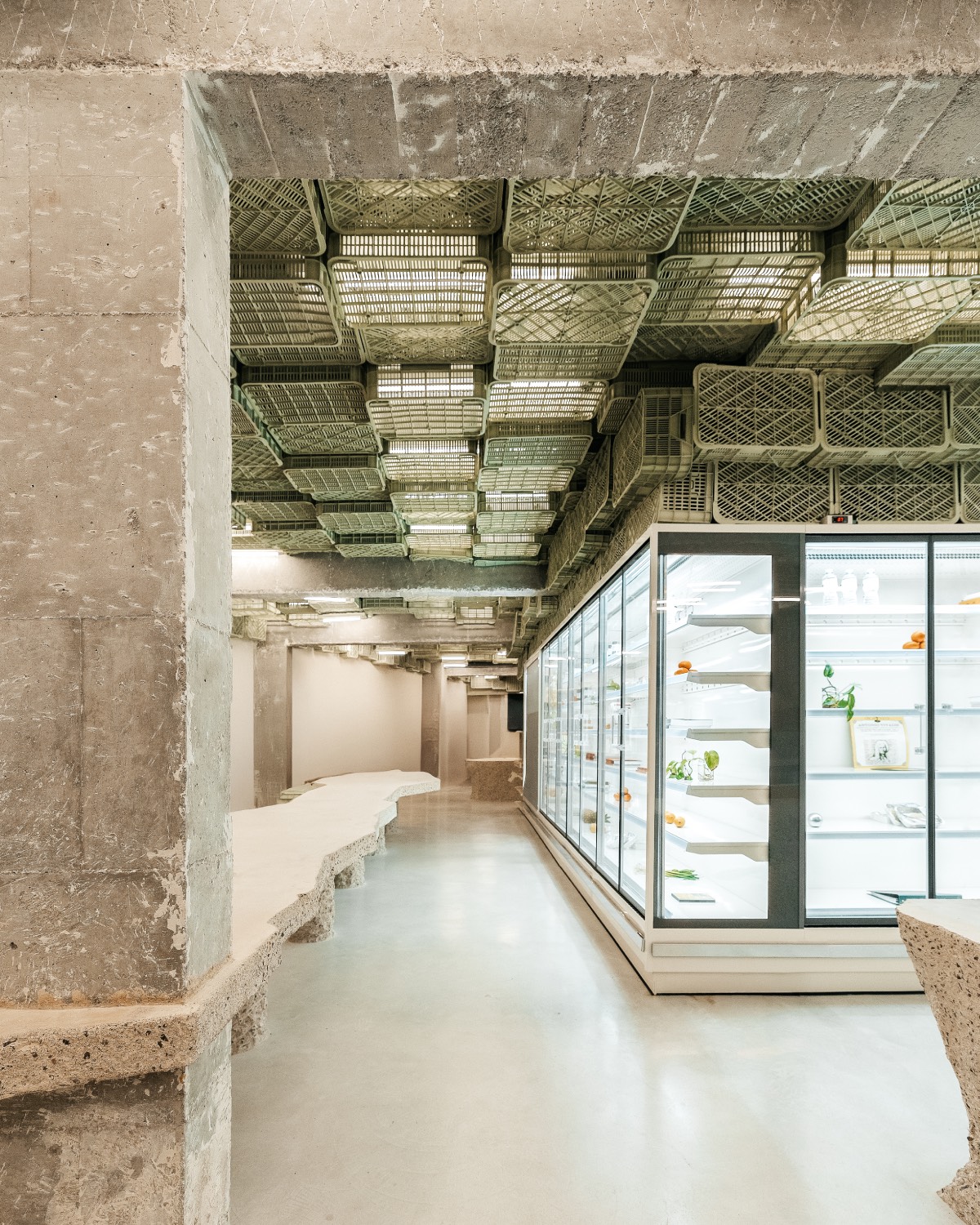 Rough and polished concrete surfaces add texture to the interior by Minimal Studio