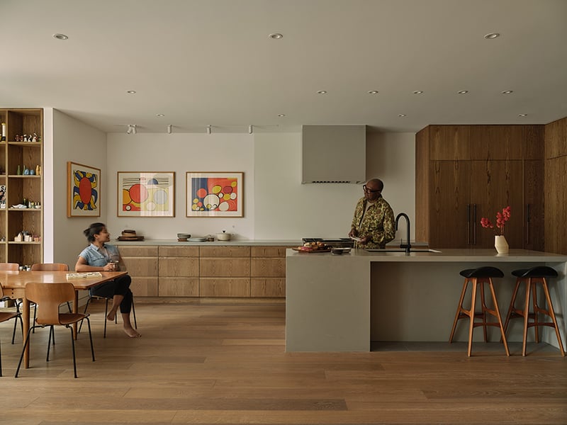 The open-concept kitchen hosts Kenneth Montague’s eclectic collection of salt and pepper shakers — and a trio of lithographs by Alexander Calder.