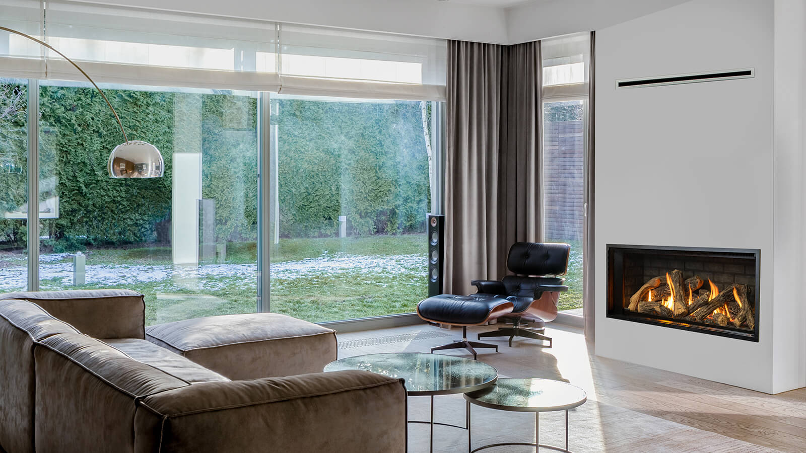 Living room with sofa, arc lamp, Eames lounge chair