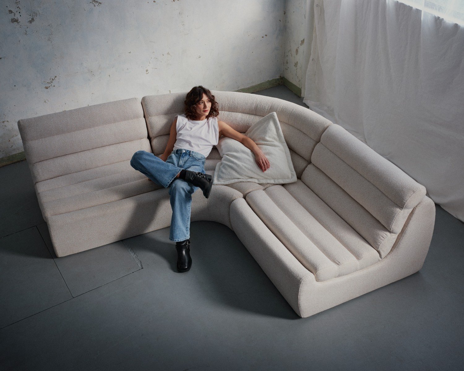 Curved couch with horizontal tufting