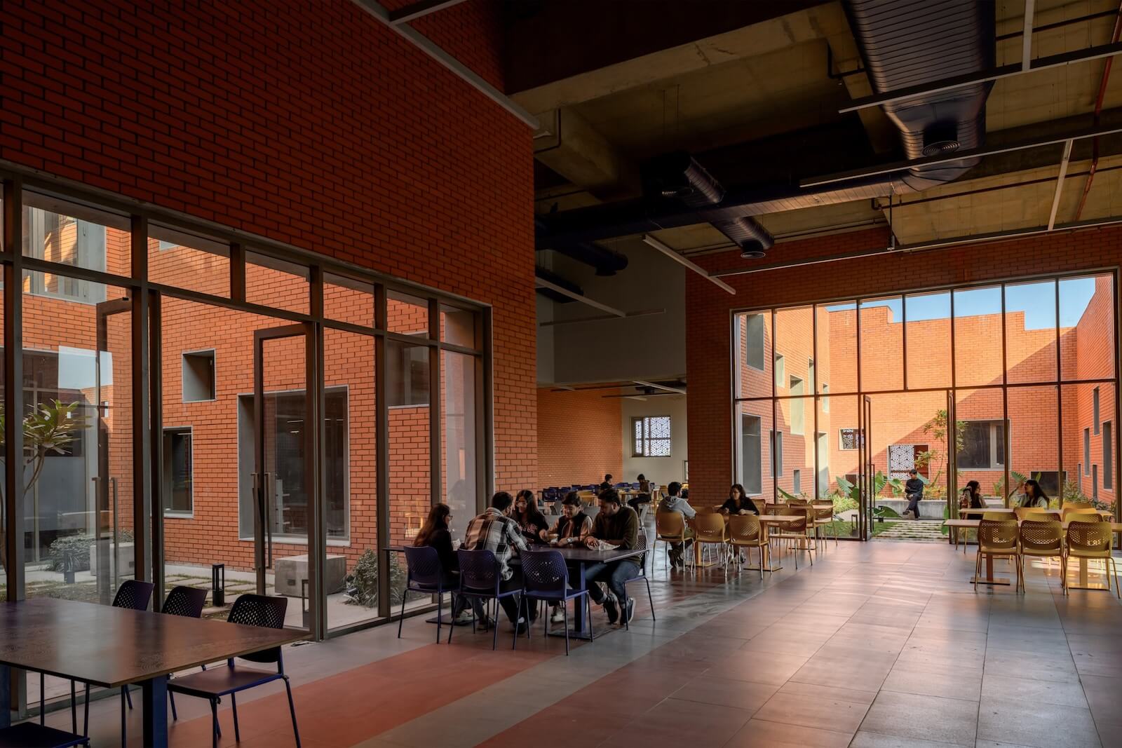 An interior setting of Prestige University, with students working together at a desk