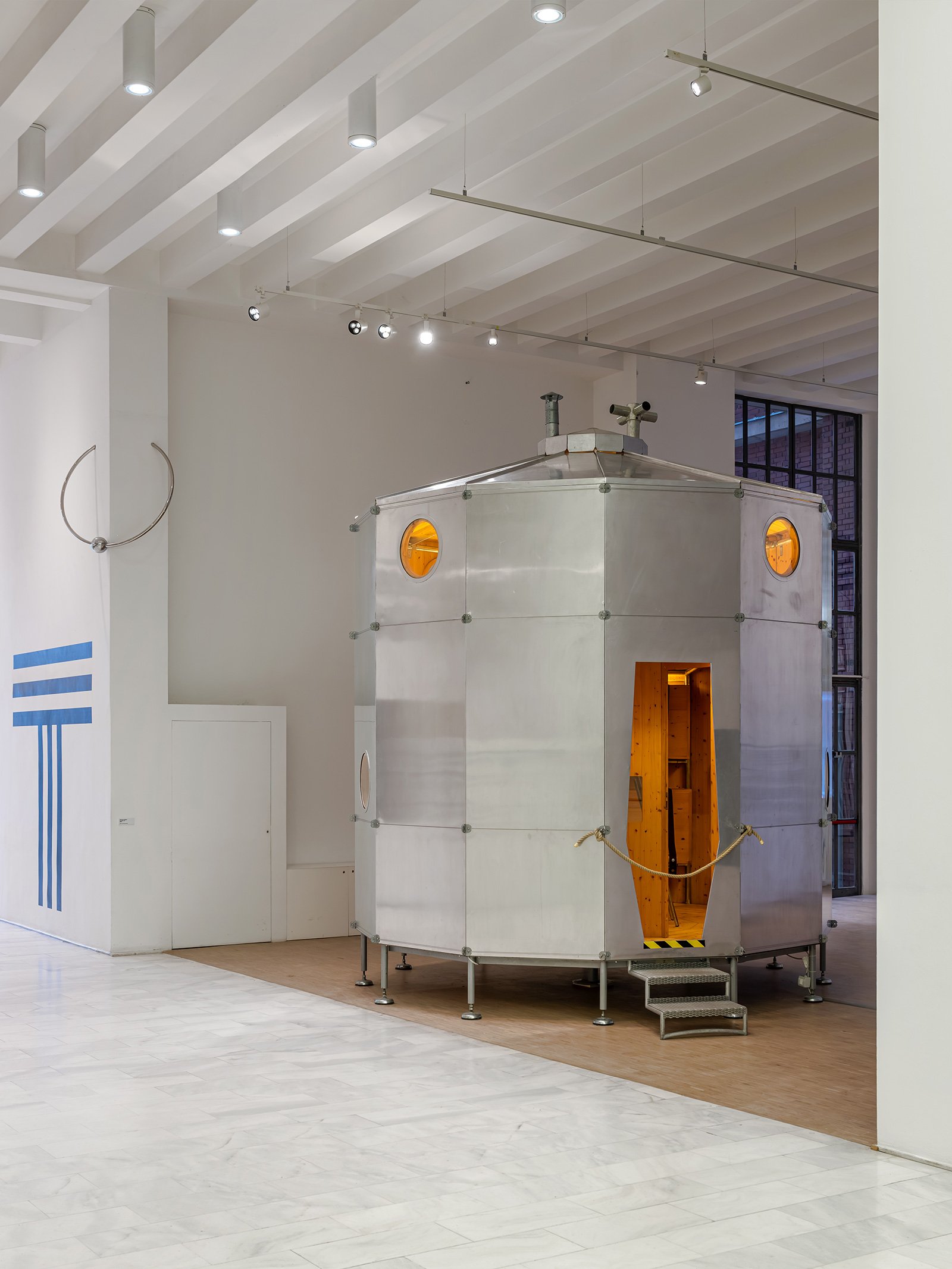 A view of the metal outside of Refuge Tonneau mountain shelter by Charlotte Perriand and Pierre Jeanneret at White Out a Triennale exhibition about winter sports.