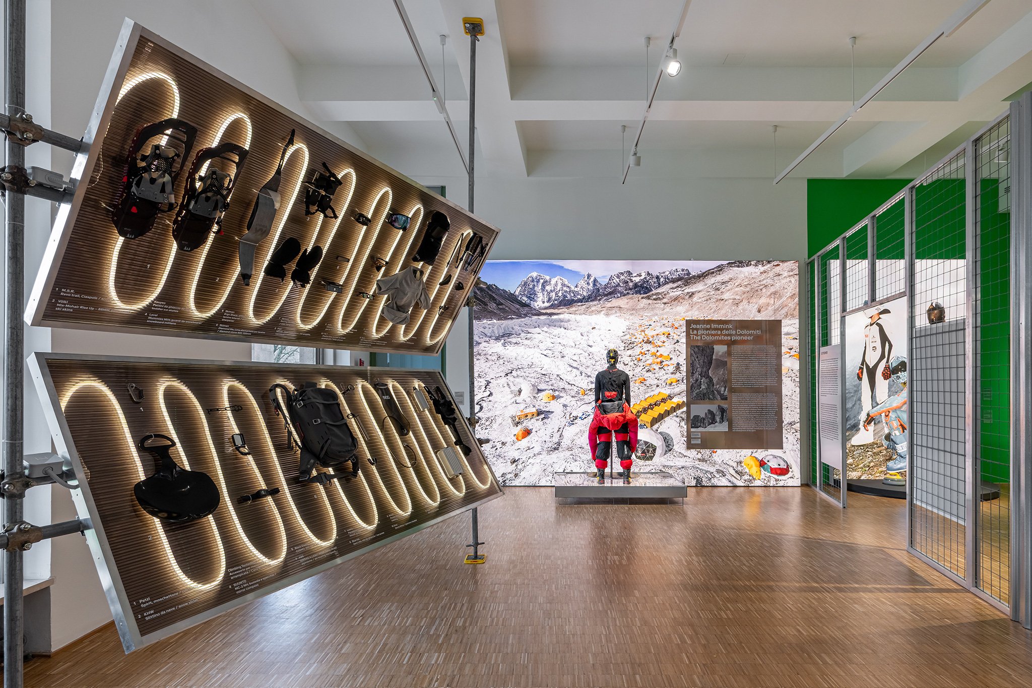 A display of snowshoes on angled panels inside a design gallery at the Triennale