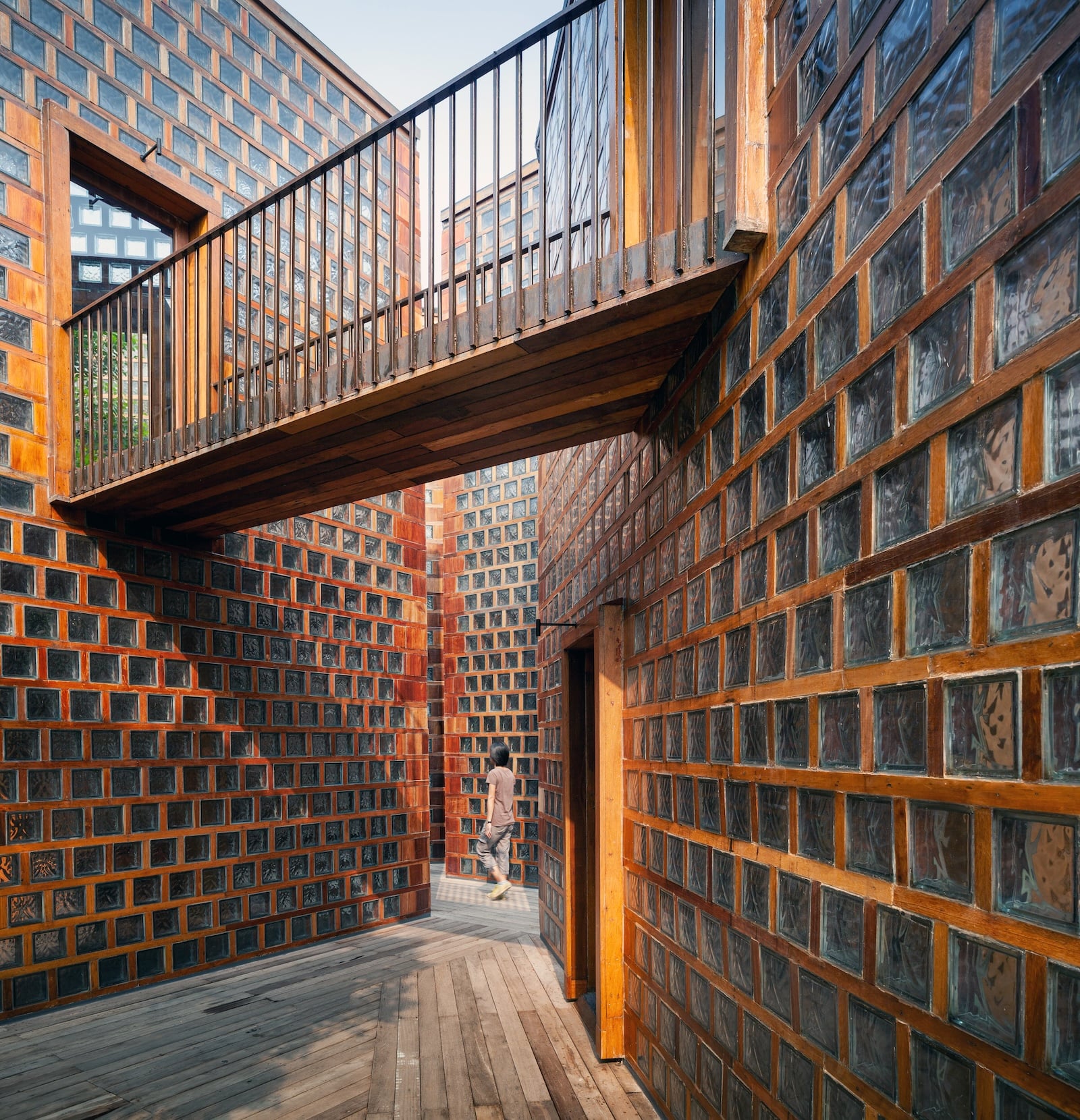 A bridge connects the second storey of two adjacent volumes at Boonserm Prethada's new restaurant in Thailand
