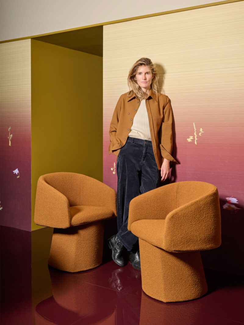 Furniture designer Chiara Andreatti poses with Cassina's Plintea chairs at Milan Design Week 2026