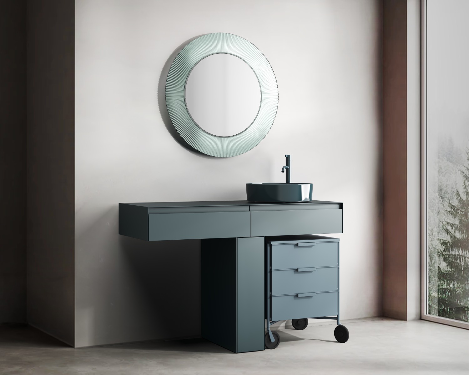 Modern bathroom featuring a round mirror, Kartell by Laufen sleek vanity with vessel sink, and a small wheeled drawer unit; large window reveals an outdoor view.
