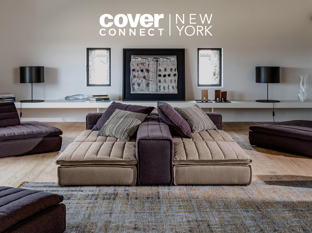 Modern living room with modular sofas, a rug, two side tables with lamps, artwork on the wall, and the text "cover connect NEW YORK" displayed at the top of the image.