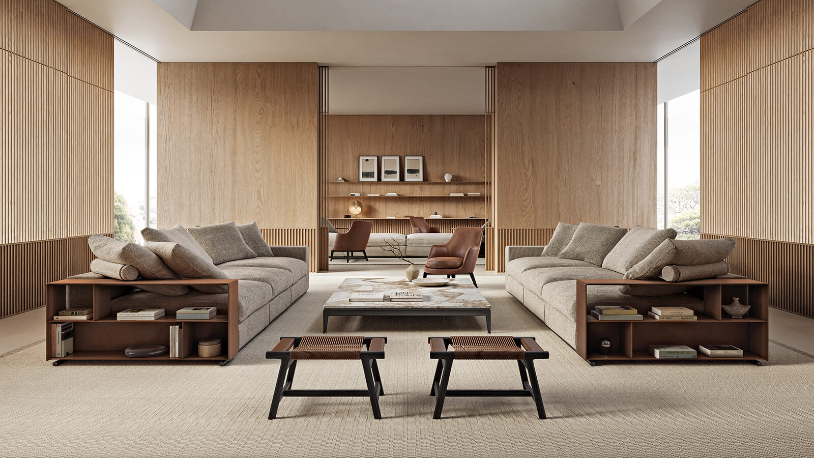 Spacious modern living room with two beige Flexform Groundpiece sofas, a central coffee table, wooden wall panels, built-in shelves, and large windows letting in natural light.