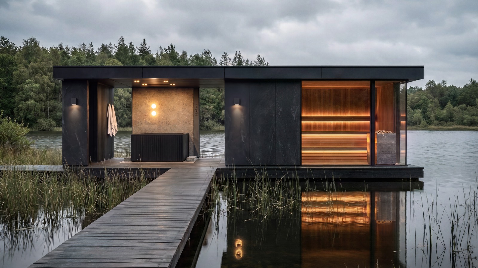 A modern sauna structure with a wooden dock extending over a lake, featuring a glass-enclosed interior with tiered seating.