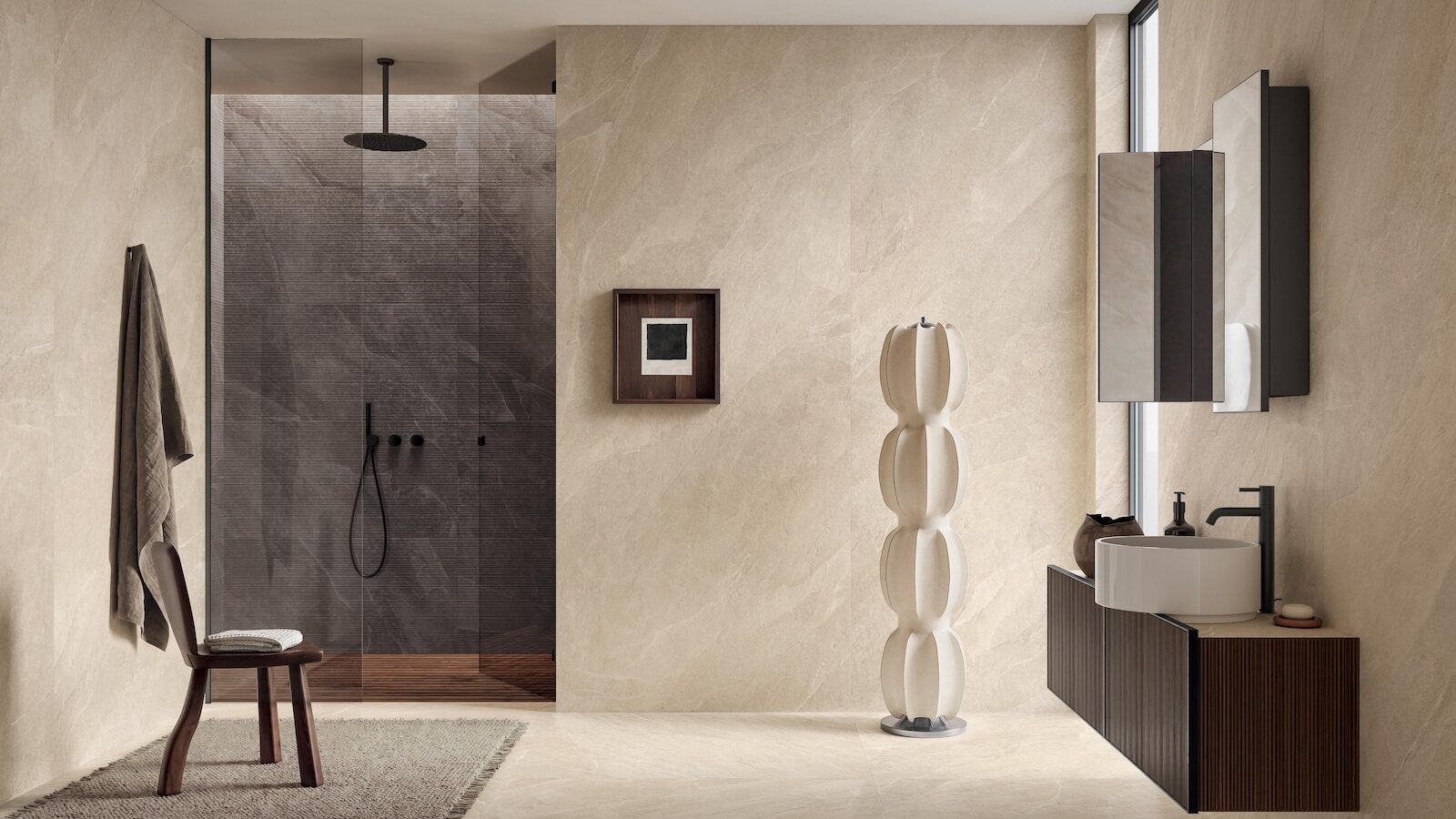 Modern bathroom with stone-look walls, a walk-in glass shower, a floating vanity with a vessel sink, and a sculptural floor lamp.